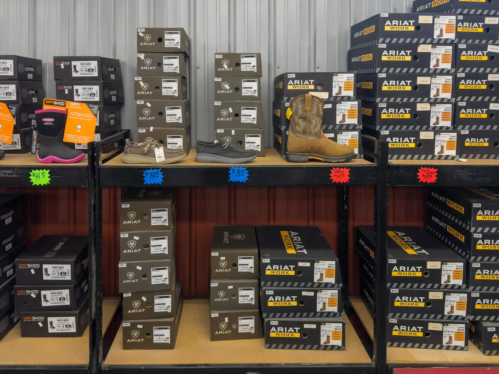 Ariat Work and Dryshod boots on the shelf at Mullins Supply Barn